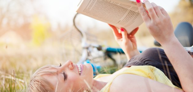 beautiful-caucasian-woman-reading-outdoor